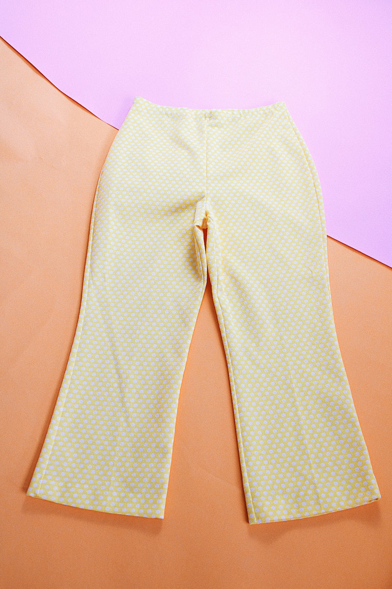 stretchy polyester yellow flare pants with white polka dots vintage women's 1970's