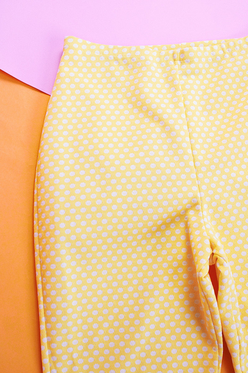 stretchy polyester yellow flare pants with white polka dots vintage women's 1970's