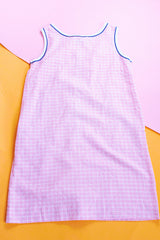 sleeveless knee length light pink with white checkered house dress zips up the front vintage 1970's