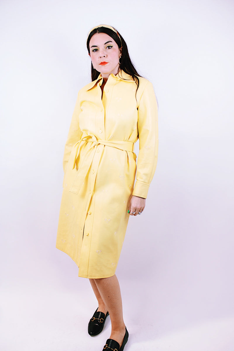 long sleeve pastel yellow vinyl shirt dress with matching tie and embroidered flowers vintage women's