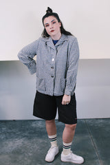 Women's vintage 1960's Pendelton label wool button up lightweight plaid jacket with big shell buttons up the front. Cream, navy, tan, and blue. Has pockets and shoulder pads.
