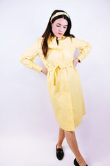long sleeve pastel yellow vinyl shirt dress with matching tie and embroidered flowers vintage women's