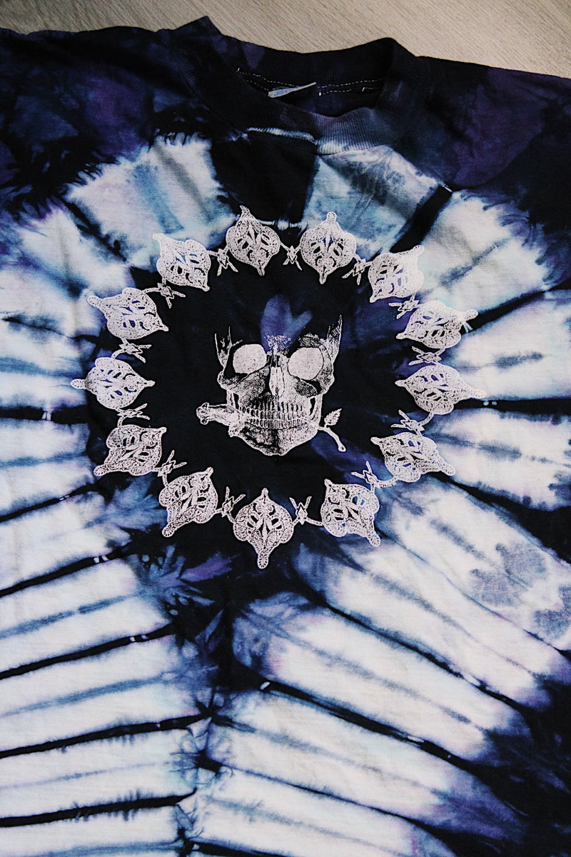 purple and navy tie dye short sleeve t-shirt with skull and skeleton graphics on the front and back 1990's