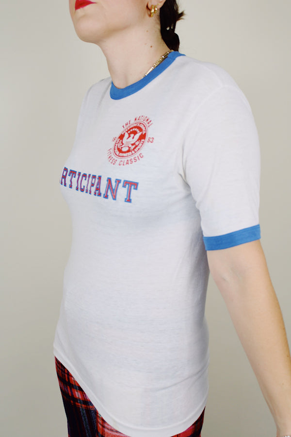 short sleeve white graphic ringer tee from 1983 blue trim vintage