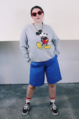 Women's or men's vintage 1980's Disney Character Fashions, Made in USA label long sleeve heather grey pullover crewneck sweater with Mickey Mouse graphic on the front.