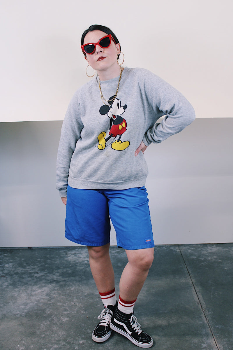 Women's or men's vintage 1980's Disney Character Fashions, Made in USA label long sleeve heather grey pullover crewneck sweater with Mickey Mouse graphic on the front.