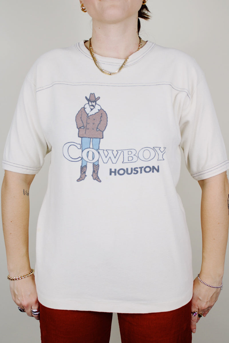 short sleeve cream colored cotton t-shirt with cowboy houston graphic on the front vintage 1970's