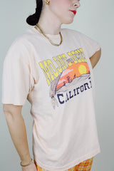 Short sleeve peach colored cotton graphic tee vintage 1990's