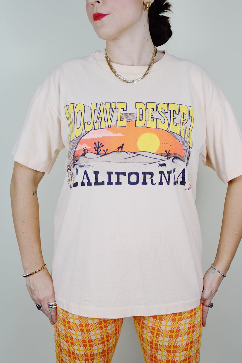 Short sleeve peach colored cotton graphic tee vintage 1990's