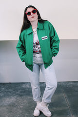 Women's or men's vintage 1970's K-Brand label long sleeve vibrant green zip up station jacket in lightweight cotton with patch on chest.