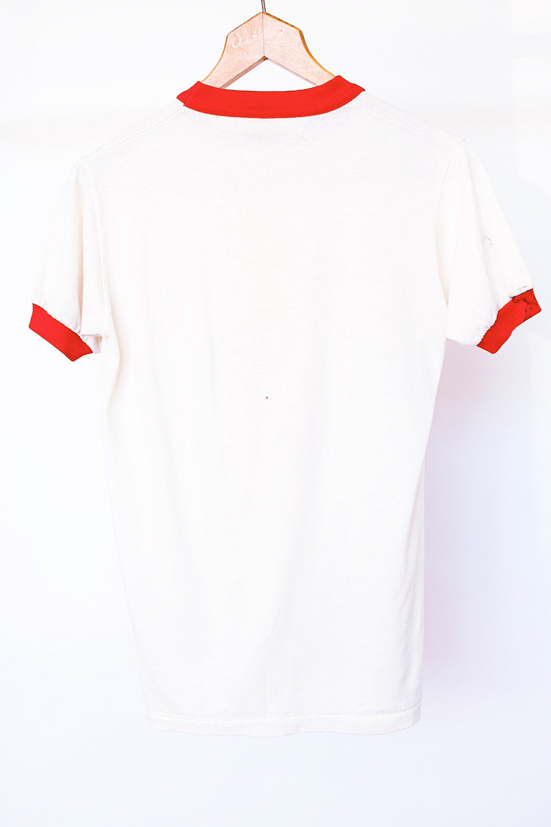 short sleeve white vintage graphic tee with red ribbed neckline and cuffs