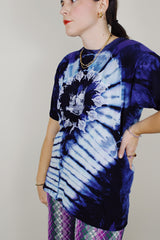 purple and navy tie dye short sleeve t-shirt with skull and skeleton graphics on the front and back 1990's