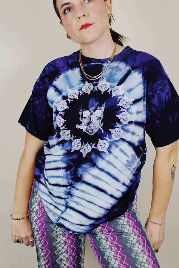 purple and navy tie dye short sleeve t-shirt with skull and skeleton graphics on the front and back 1990's