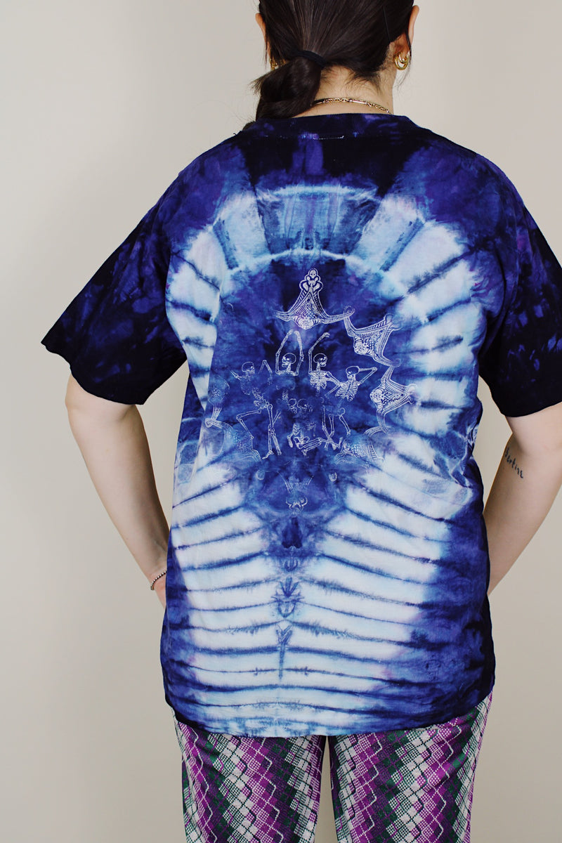 purple and navy tie dye short sleeve t-shirt with skull and skeleton graphics on the front and back 1990's