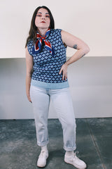 Women's or men's vintage 1970's sleeveless navy and blue printed sweater vest with ribbed trim. Soft acrylic material.