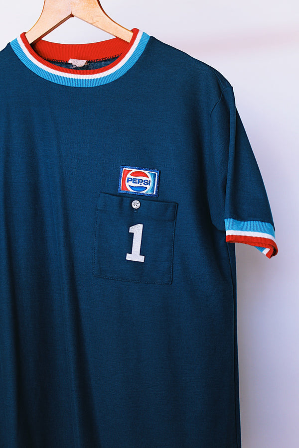 short sleeve navy t-shirt with pepsi patch and red white and blue ribbed trim vintage 1970's