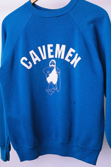 long sleeve blue crew neck sweater with cavemen graphic vintage 1970's