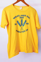 short sleeve yellow cotton vintage t-shirt from 1982 with graphic on front