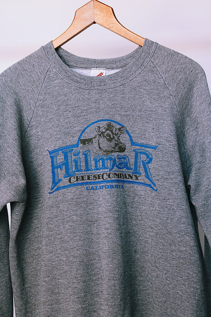 long sleeve grey crew neck sweater with cow graphic on front vintage 1980's