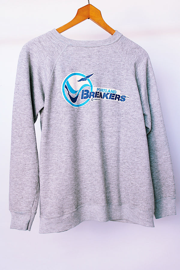 long sleeve grey vintage 1983 crew neck sweater with portland breakers graphic