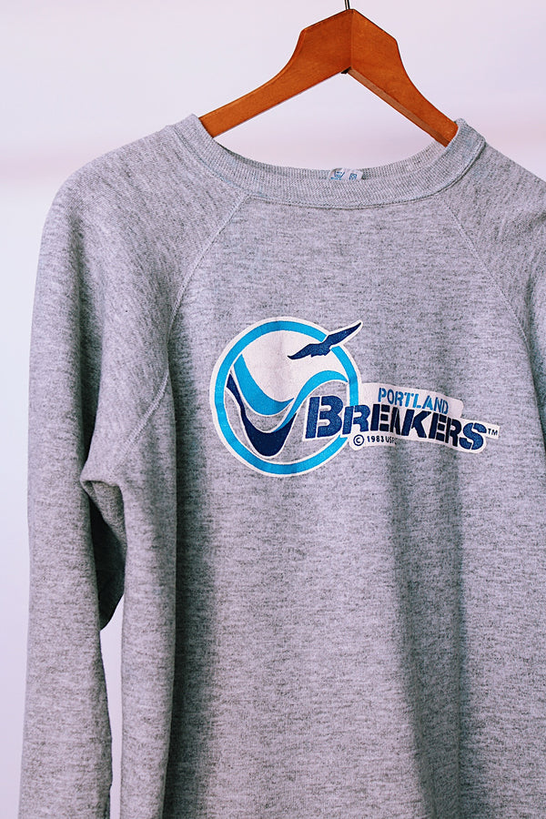 long sleeve grey vintage 1983 crew neck sweater with portland breakers graphic