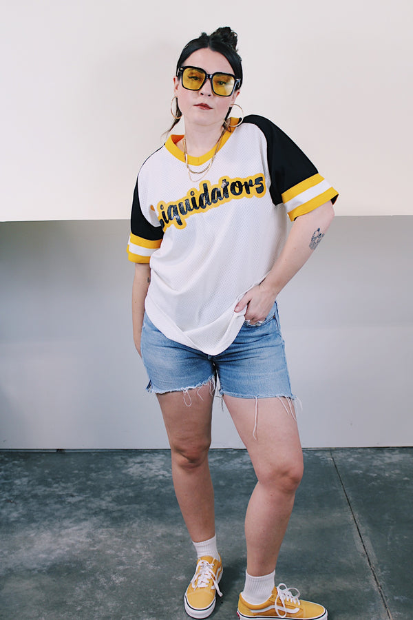 Women's or men's vintage 1980's Willamette Athletic, Portland short sleeve white, yellow, and black mesh stretch nylon sports jersey with v shaped neckline.