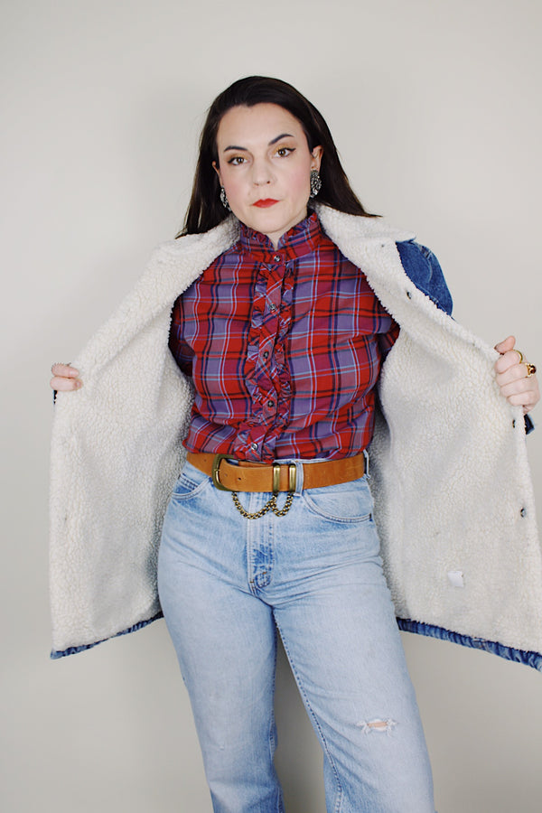 vintage 1970's Levi's San Francisco long sleeve medium wash denim jacket with a white shearling liner and a long fit