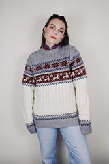 vintage 1980's High Sierra Mervyn's long sleeve cable knit pullover print with a reindeer print across the chest. White with grey, maroon, and navy print.