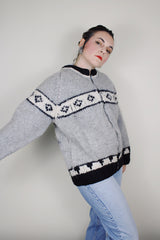 vintage 1970's long sleeve wool zip up cowichan cardigan in grey, white, and black with a deer design on the back
