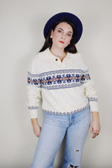 vintage 1980's Jantzen, Made in USA label long sleeve white cable knit pullover sweater with a collar, one button half closure, and an abstract print across chest