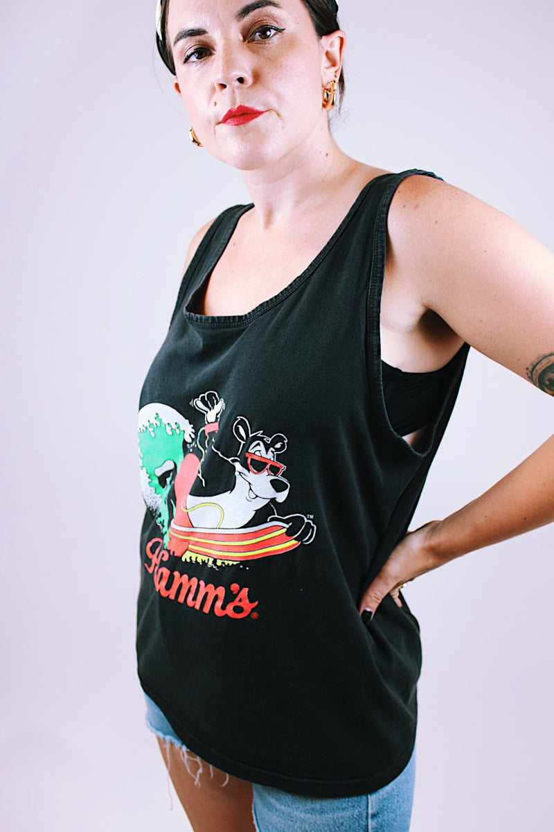 sleeveless oversized black tank top t-shirt with Hamm's on the front and bear surfing 1980's vintage