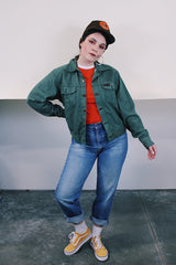 Women's or men's vintage 1990's Dickies label long sleeve green button up lightweight jacket with two chest pockets and collar.