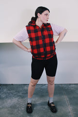 Women's or men's vintage 1980's Ozark Trail label sleeveless zip up black and red buffalo plaid vest with side pockets in cotton material.