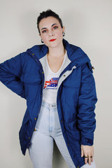 vintage 1980's Woolrich, Made in USA label long sleeve dark blue zip up parka jacket with removable hood, four front velcro pockets, and brass popper buttons