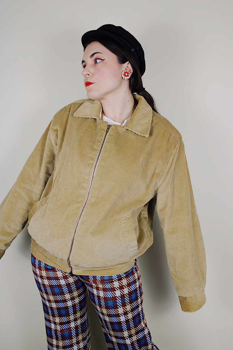 vintage 1980's long sleeve beige brown corduroy jacket with bronze zipper up the front, a pointy collar and side pockets
