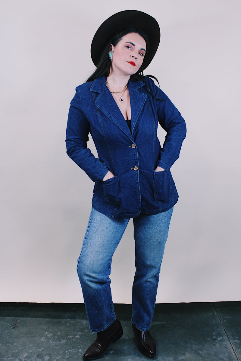 Women's vintage western style 1970's dark wash denim blazer with two wood buttons, two pockets, double lapel in cotton material.