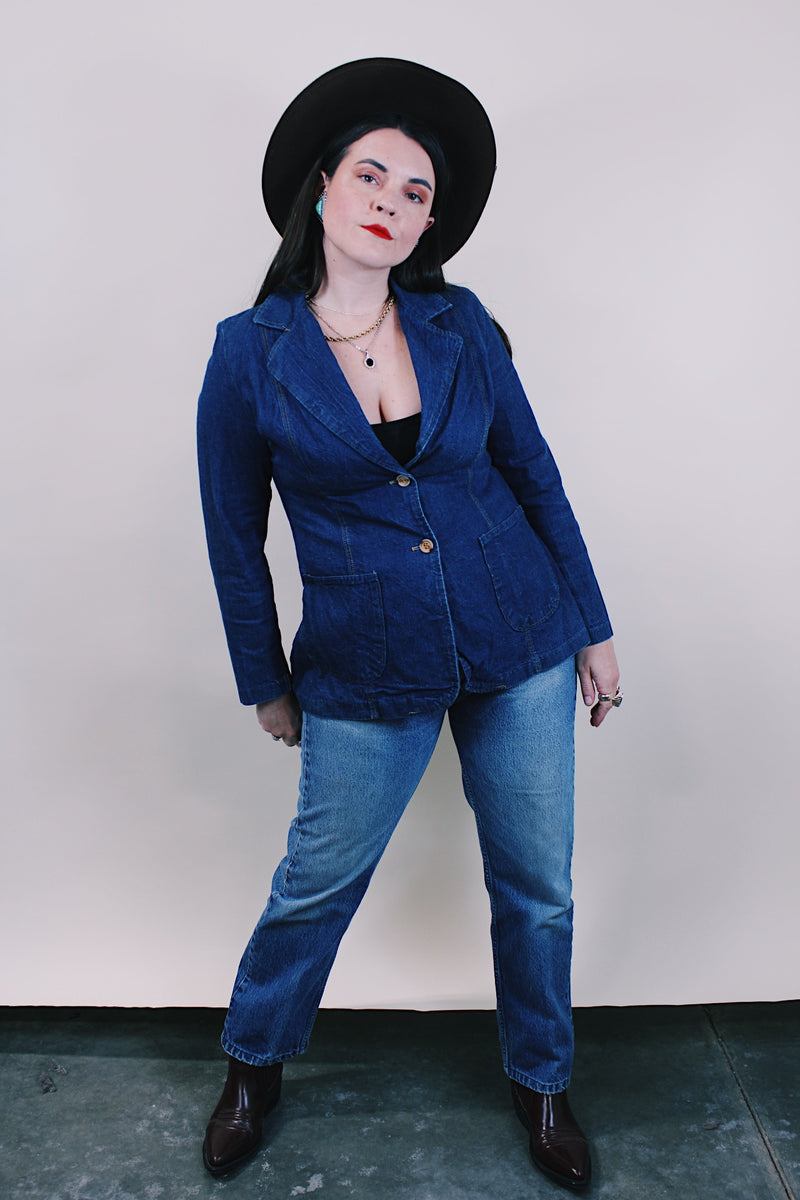 Women's vintage western style 1970's dark wash denim blazer with two wood buttons, two pockets, double lapel in cotton material.