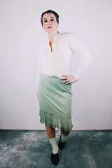knee length vintage 1960's min colored nylon slip skirt with pleated ruffle hem