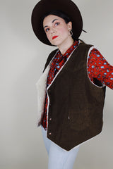 Men's vintage 1970's Levi's sleeveless brown corduroy vest with a cream shearling liner and popper buttons up the front