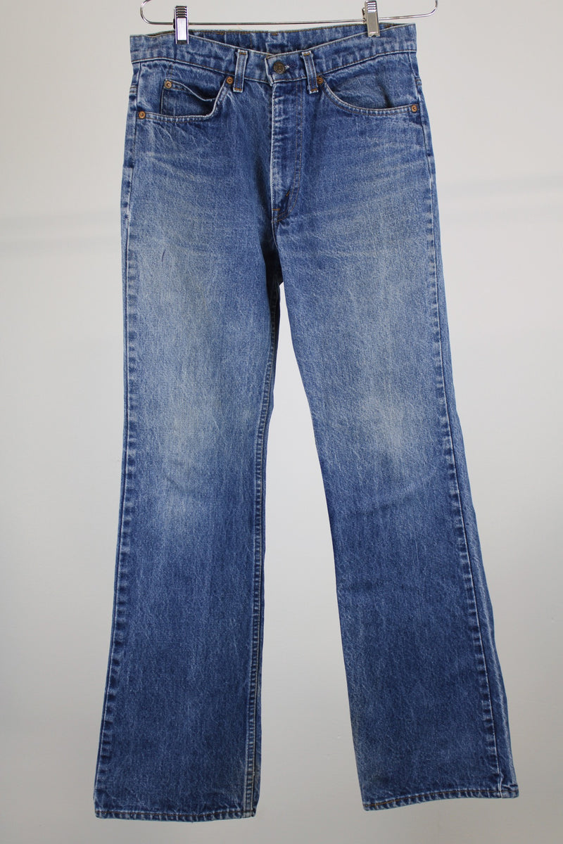 SF 207 levi's jeans 30 width x 33 length in a medium wash