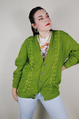 vintage 1960's SKM Penguin, Seattle Knitting Mills label long sleeve green button up wool cardigan with braiding detail on each side and tan leather patches on the elbows