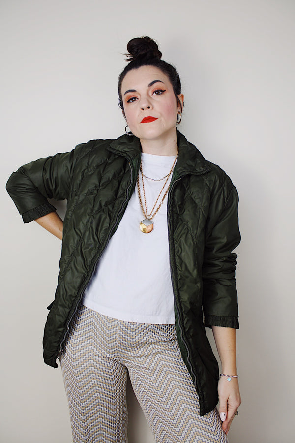 Women's vintage 1970's White Stag, USA label long sleeve olive green nylon quilted puffer jacket with silver zipper up the front