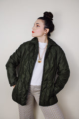 Women's vintage 1970's White Stag, USA label long sleeve olive green nylon quilted puffer jacket with silver zipper up the front