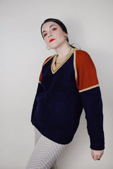 Women's vintage 1980's Silton California long sleeve v shaped neck pullover sweater in a navy textured material with burnt orange and tan shoulders