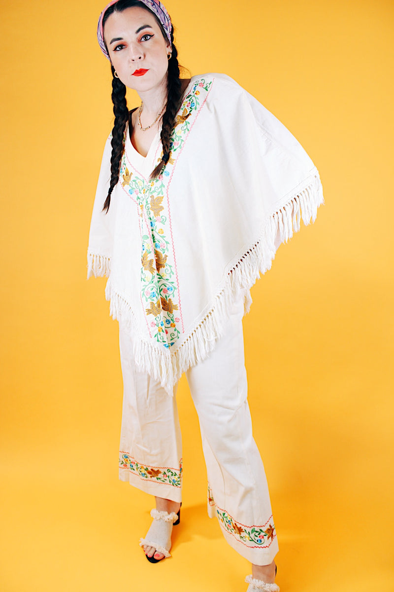1970's cream colored fringed poncho and pant set with floral and bird embroidery 
