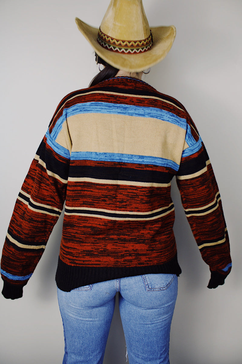 vintage 1970's Montgomery Ward long sleeve acrylic material pullover sweater with a brown, maroon, tan, and blue all over print