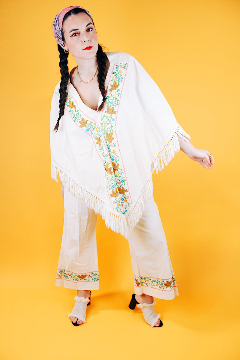 1970's cream colored fringed poncho and pant set with floral and bird embroidery 