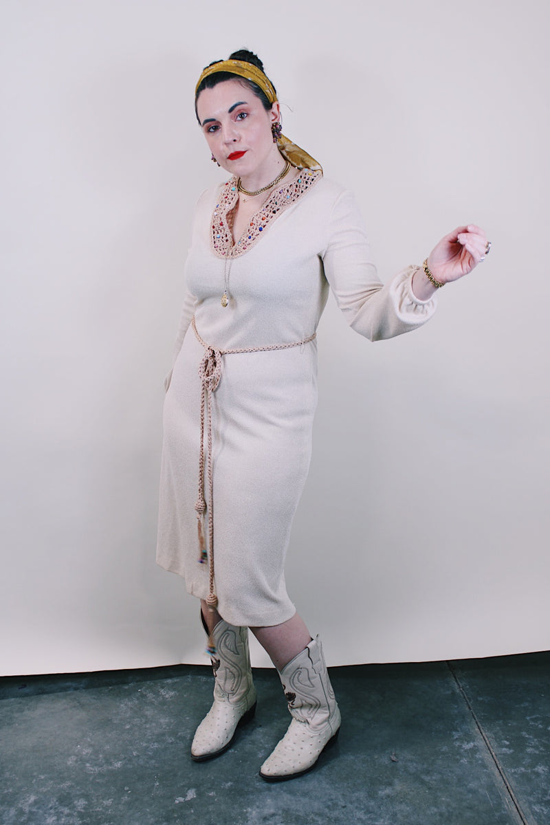 Women's vintage 1970's Keith Adams For Tannel label long sleeve midi length cream tan colored tunic dress with embroidered neckline with bead and a tassel beaded belt.