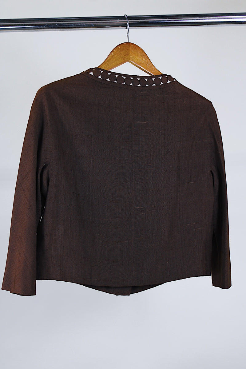 Women's vintage 1960's Buddy Bates label pure silk 3/4 arm length cropped chocolate brown jacket with round neck, three fabric covered buttons, and a full liner. 