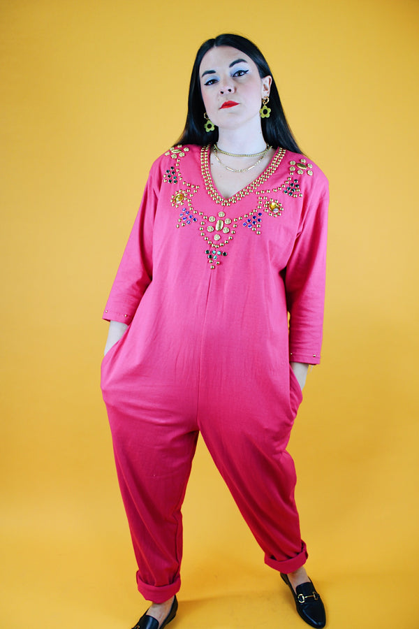 long sleeve hot pink jumpsuit with jewels around neckline and cuffs vintage 1980's